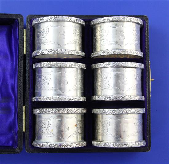 A cased set of George V silver napkin rings,